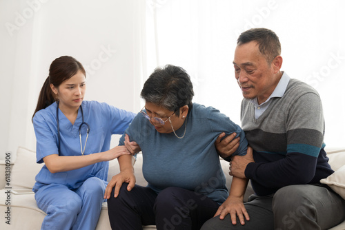 Nurse and patient Asian elderly woman. Nurse caring Asian elderly woman on sofa at hospital. Asian nurse taking care patient older woman with kindly