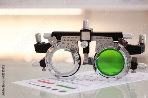 Trial frame glasses for eye test on a table 