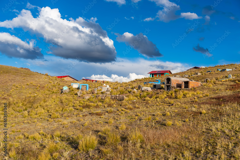 houses of noble material bricks and steel built near a rural cemetery of peasant communities very common in the Andes of Peru houses of noble material bricks and steel built near a rural cemetery of peasant communities very common in the Andes of Peru