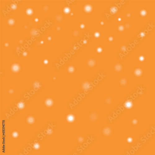 White bokeh on an orange background. Background for autumn design