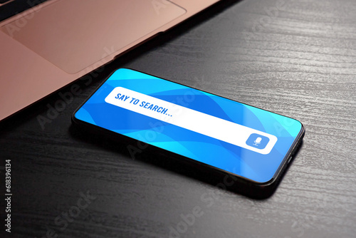 Voice search and speech recognition with stunning close-up of smartphone with voice search bar on the screen. Say to search high-quality photo concept