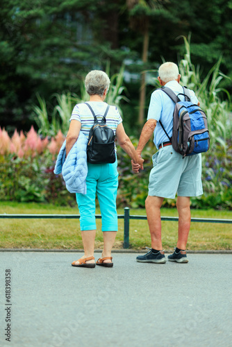 A retired couple on a relaxing walk in the park. © Robert