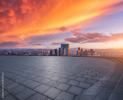 Empty floor and modern city skyline with building at sunset in Suzhou, China. high angle view.