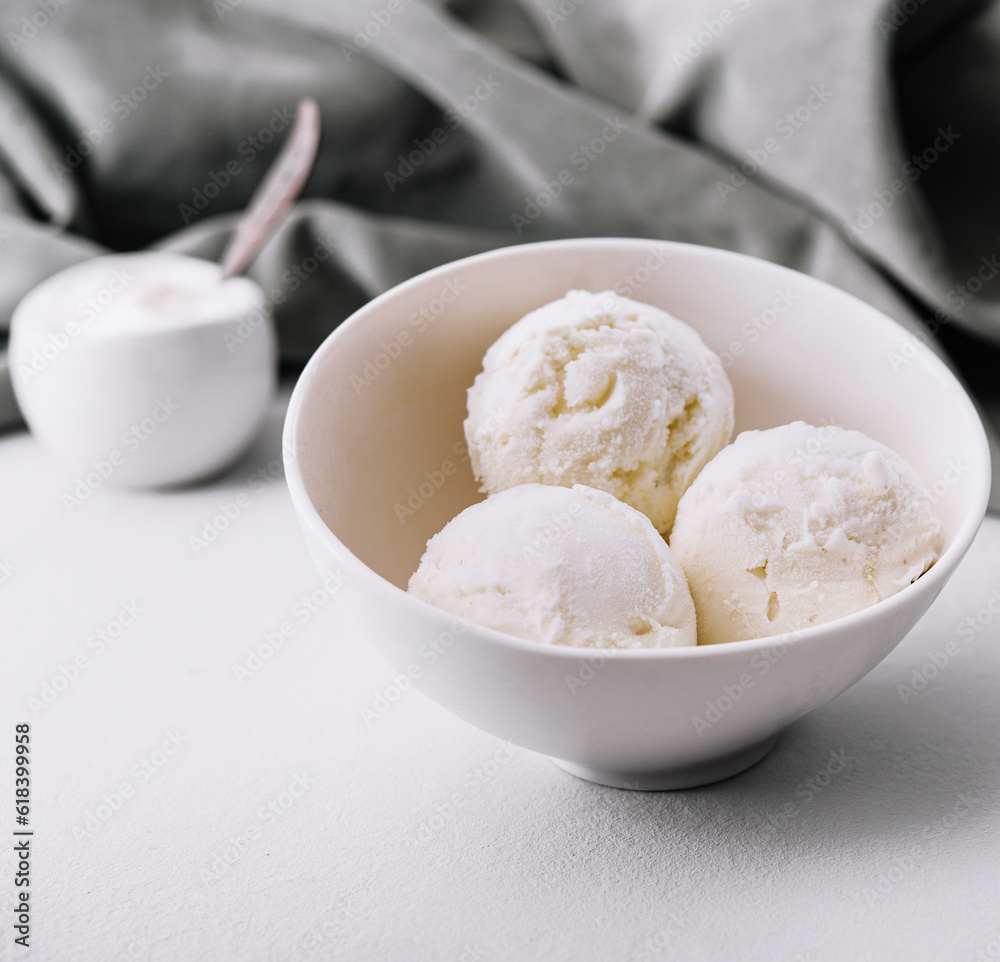 Vanilla ice cream balls in bowl