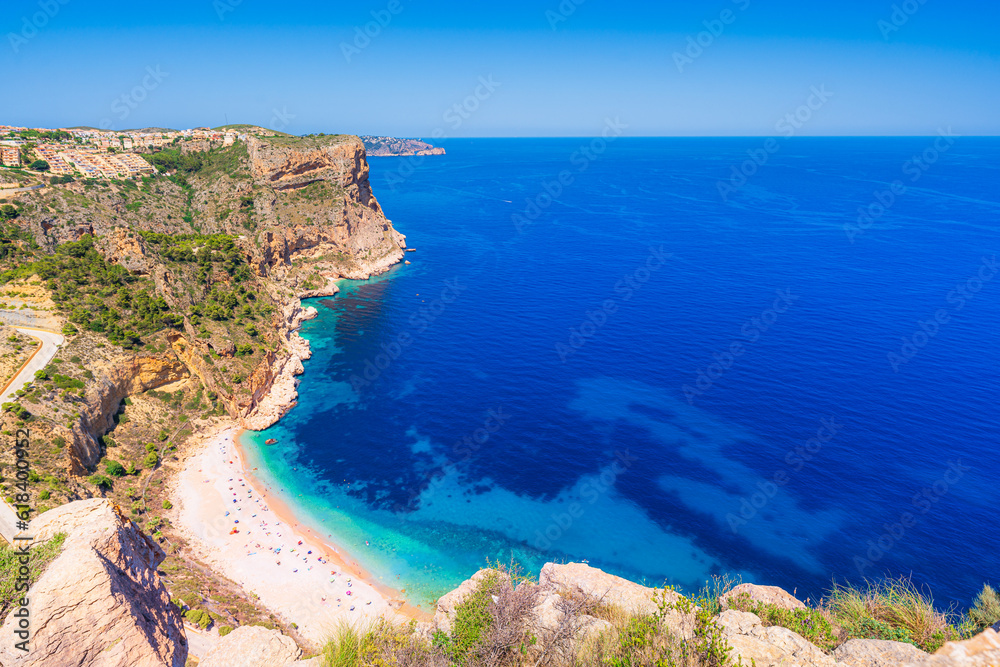 Scenic view of Cala del Moraig turquoise cove in the Mediterranean Sea, Comunidad Valenciana, Spain