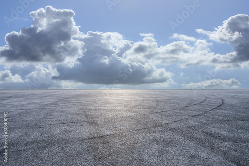 Asphalt road and sky clouds background