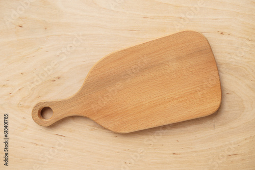 Kitchen cutting empty board on wooden table, top view