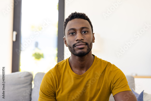 Happy african american man making video call in living room