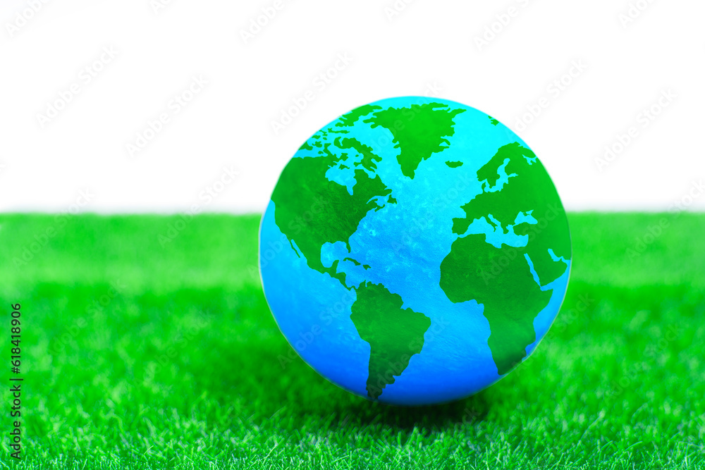 Global Harmony: Miniature Globe on Green Lawn Global Harmony: Miniature Globe on Green Lawn