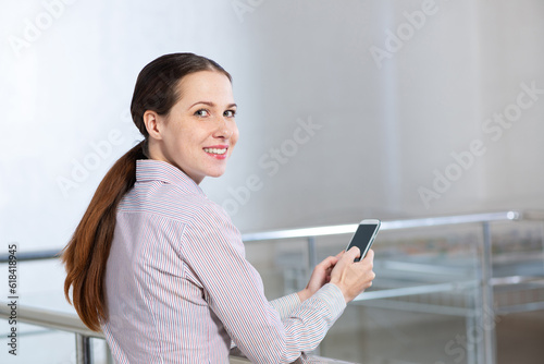 young attractive woman with phone in her hands