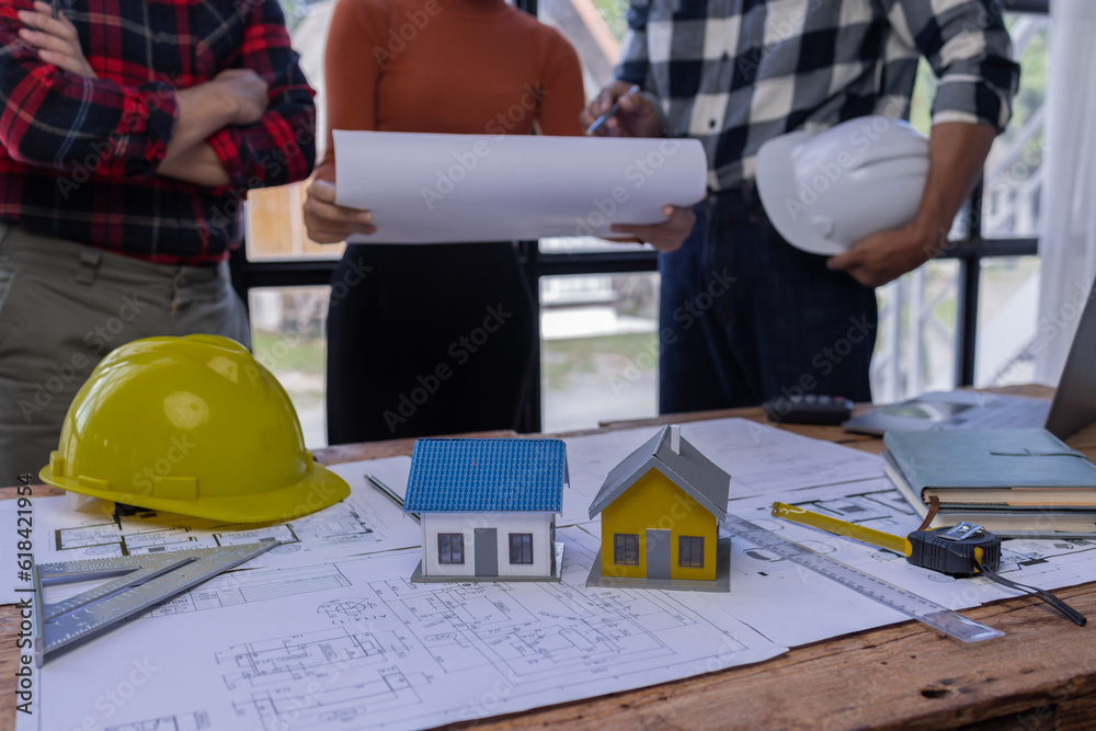 Engineer Teamwork Meeting, Architect contractor meetings of real estate brokers and company presidents to select a model to build a housing estate in writing and presenting to state organizations. Engineer Teamwork Meeting, Architect contractor meetings of real estate brokers and company presidents to select a model to build a housing estate in writing and presenting to state organizations.