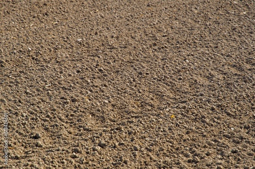 High resolution image of a large, recently plowed field, set on a sunny farm land