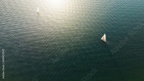 Fotografie Aerial view of sailboats drifting across the serene waters of Lake Norman in Cor