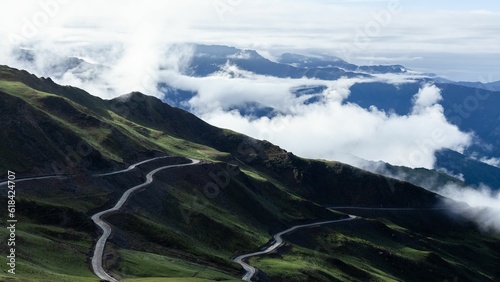 Scenic view of winding mountain roads on a cloudy day. Four Girls Mountain  Sichuan Province  China.