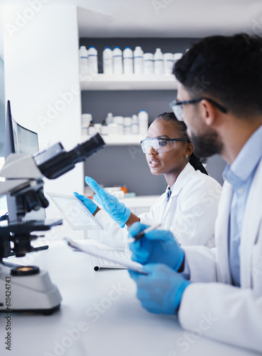 Fototapeta Naklejka Na Ścianę i Meble -  Scientist man, woman and tablet for microscope analysis, dna or virus for pharmaceutical company in lab. Teamwork, medical research and digital touchscreen for data, info or pharma study for wellness