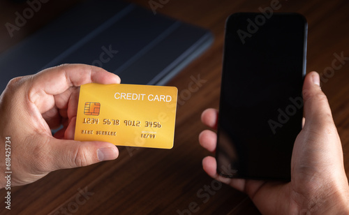 businessman hold business credit card and pay online e-commerce shopping with online customer store with smartphone, money debt bank and business concept