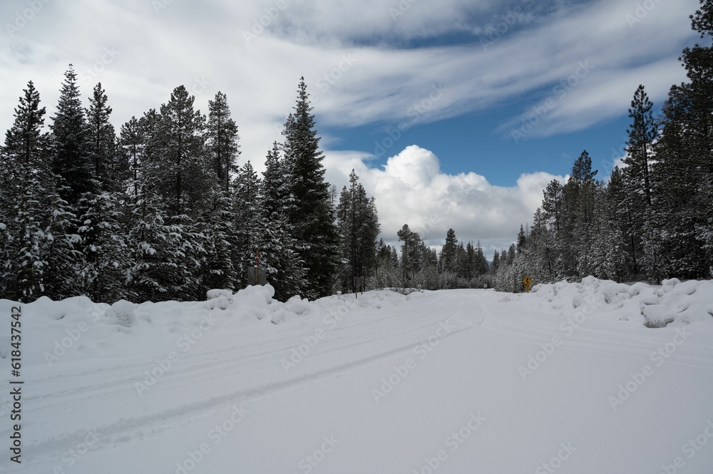 Picturesque winter landscape featuring a winding snow trach blanketed in snow in Central Oregon