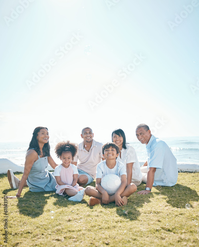 Generation, children and portrait sitting on grass in summer with ball for quality time on mockup space. Happiness, parents and big family in nature in garden for bond with love on holiday or house.