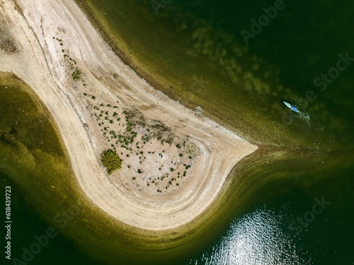 Aerial view over a large sandbar in the green waters of Oyster Bay in Lloyd Harbor on Long Island