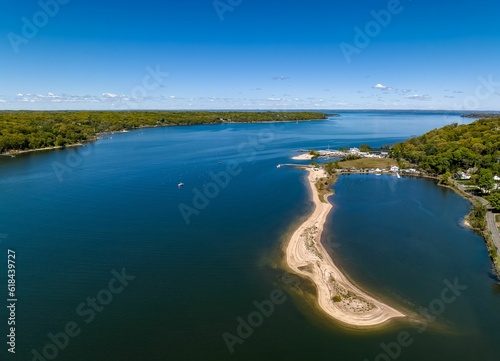 Fotografie Aerial view over a large sandbar in the green waters of Oyster Bay in Lloyd Harb