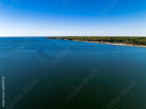 Aerial view over the calm waters in Oyster Bay near Lloyd Harbor, New York on a sunny day