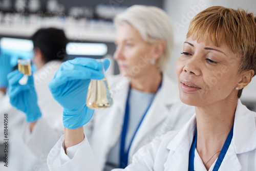 Essential oil, development and scientist in a lab doing research organic and natural fragrance in a clinic. Serum, treatment and collagen expert working on a skincare, perfume or beauty product