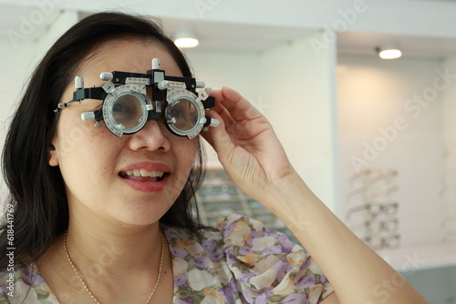 Woman eye test at optical store 