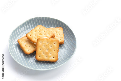 Biscuits in plate on white background.