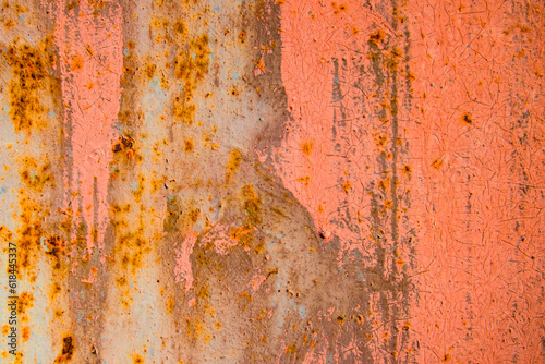 Old cracked paint in craquelure on a rusty metal surfaceGrunge rusted metal texture. Rusty corrosion and oxidized background. Worn metallic iron rusty metal background. 