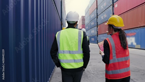 Teams of transport and container wear vest and helmet safety working in dock warehouse. Business cargo ship import and export logistic concept