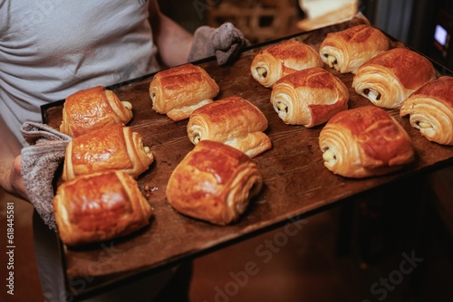 there are many croissants being made on a tray