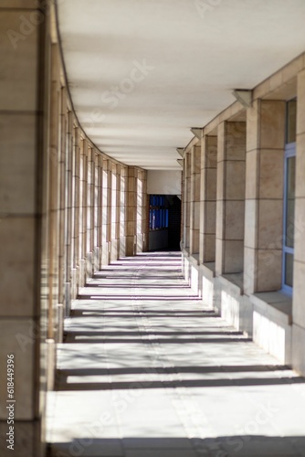 Hallway, illuminated by a bright light source, filled with shadows
