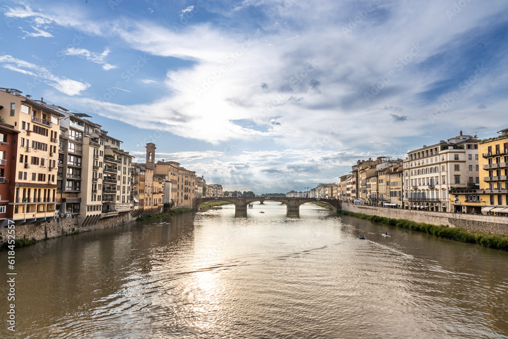 Walkway along Arno river in Florence Italy is popular route to appreciate the attractions offered on both sides of the river