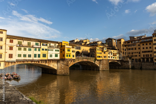 Evening sun over Ponte Vecchio  the historic old bridge over Arno river in Florence  Tuscany  Italy is popular tourist destination
