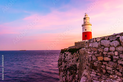 The lighthous in Gibraltar at sunset on a rock by the shores of the Mediterranean Sea