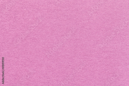 Texture of craft lilac and rose paper background, macro. Structure of vintage dense kraft pink cardboard.