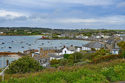 Panoramic view of picturesque Hugh Town on St Mary’s in the exotic Isles Of Scilly u.k. showing boats in the pretty harbour photo