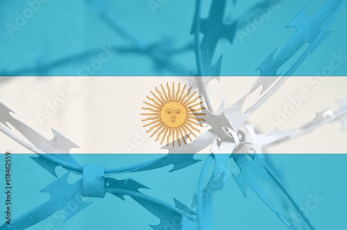 Abstract image of the national flag of Argentina with twisted barbed wire.