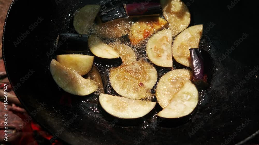 Close up video of frying eggplant in frying pan. Close up video of frying eggplant in frying pan.