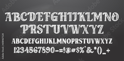 Bright white chalk board style alphabet design on blackboard background