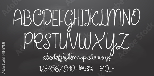 Set of retro hand drawn alphabet letters drawing with white chalk on chalkboard