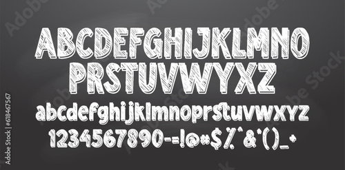 Set of retro hand drawn alphabet letters drawing with white chalk on chalkboard