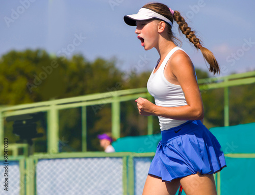 girl tennis player rejoices in winning the rally in the set © Павел Мещеряков