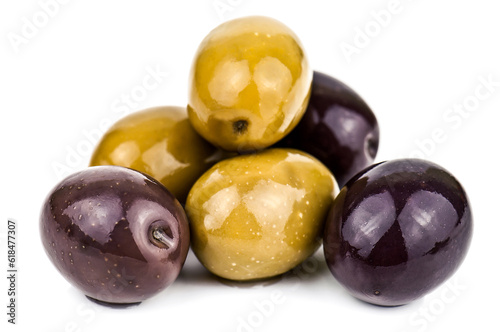 Heap of delicious black and green olives on white background