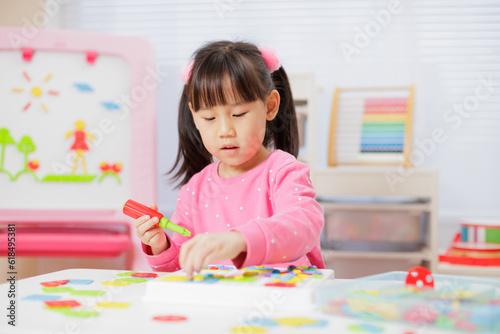 young girl was playing creative toys at home