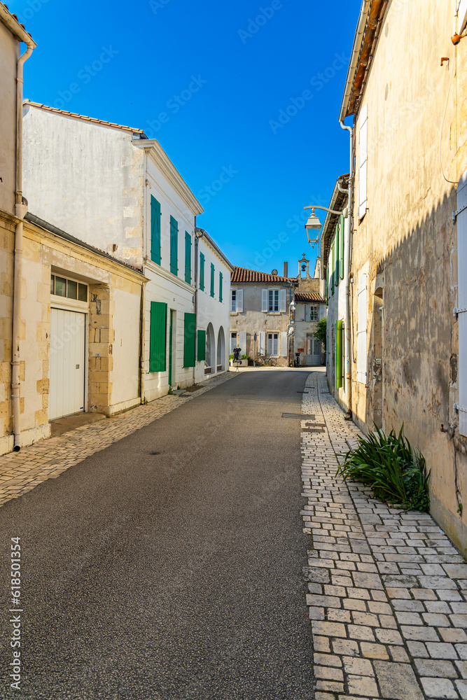 Narrow street in Ars-en-Ré, France on a sunny day