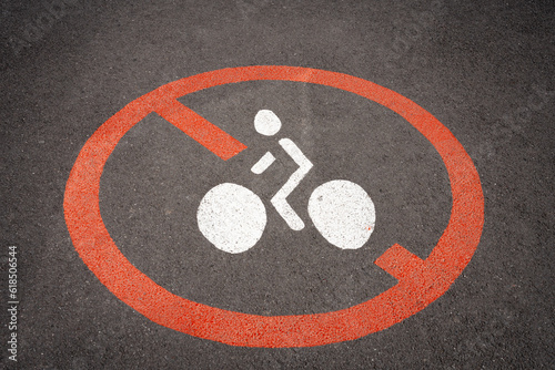 Obernai, France - 06 23 2023: A red and white cyclist road sign with a man on a bicycle and a red prohibition circle. photo