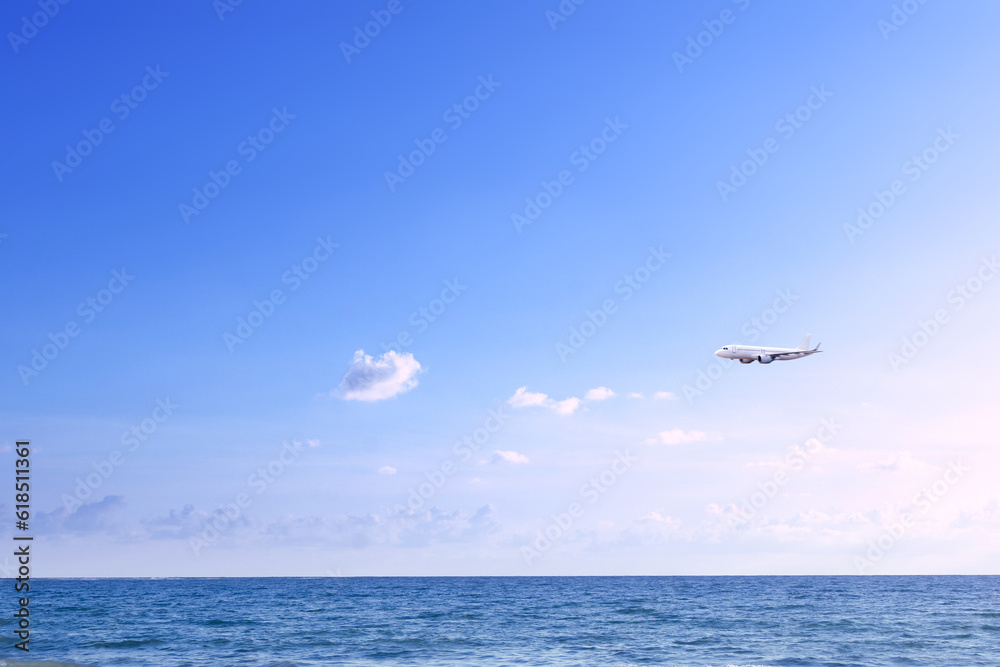 Commercial airplane above sea in summer season and clear blue sky over beautiful scenery ocean background, Concept business travel and transportation summer vacation travel. Commercial airplane above sea in summer season and clear blue sky over beautiful scenery ocean background, Concept business travel and transportation summer vacation travel.