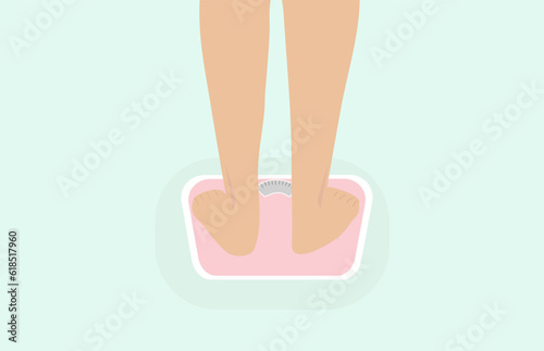 woman stands on the scales