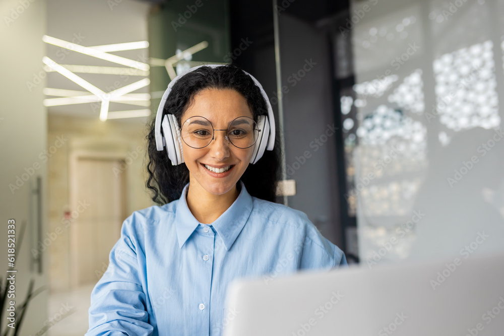 Young beautiful latin american programmer working inside office with laptop, woman coding new software security smiling and happy with achievement results. Young beautiful latin american programmer working inside office with laptop, woman coding new software security smiling and happy with achievement results.